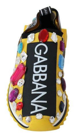 Dolce & Gabbana yellow multicolor crystal sneakers with vibrant gemstone embellishments on white athletic shoes.
