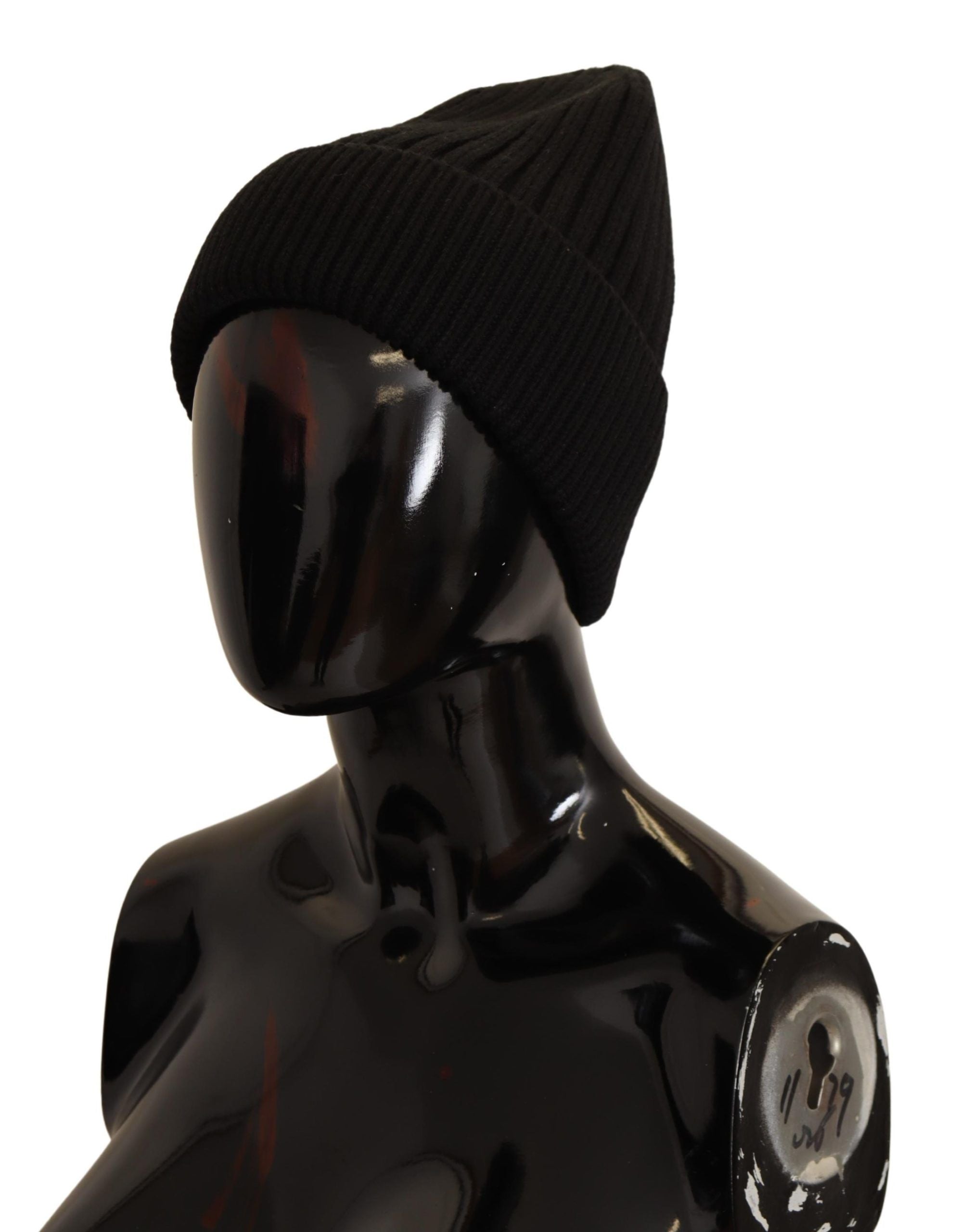 Black wool knit women's winter hat by Dolce & Gabbana, featuring a cozy, stylish design for cold weather.