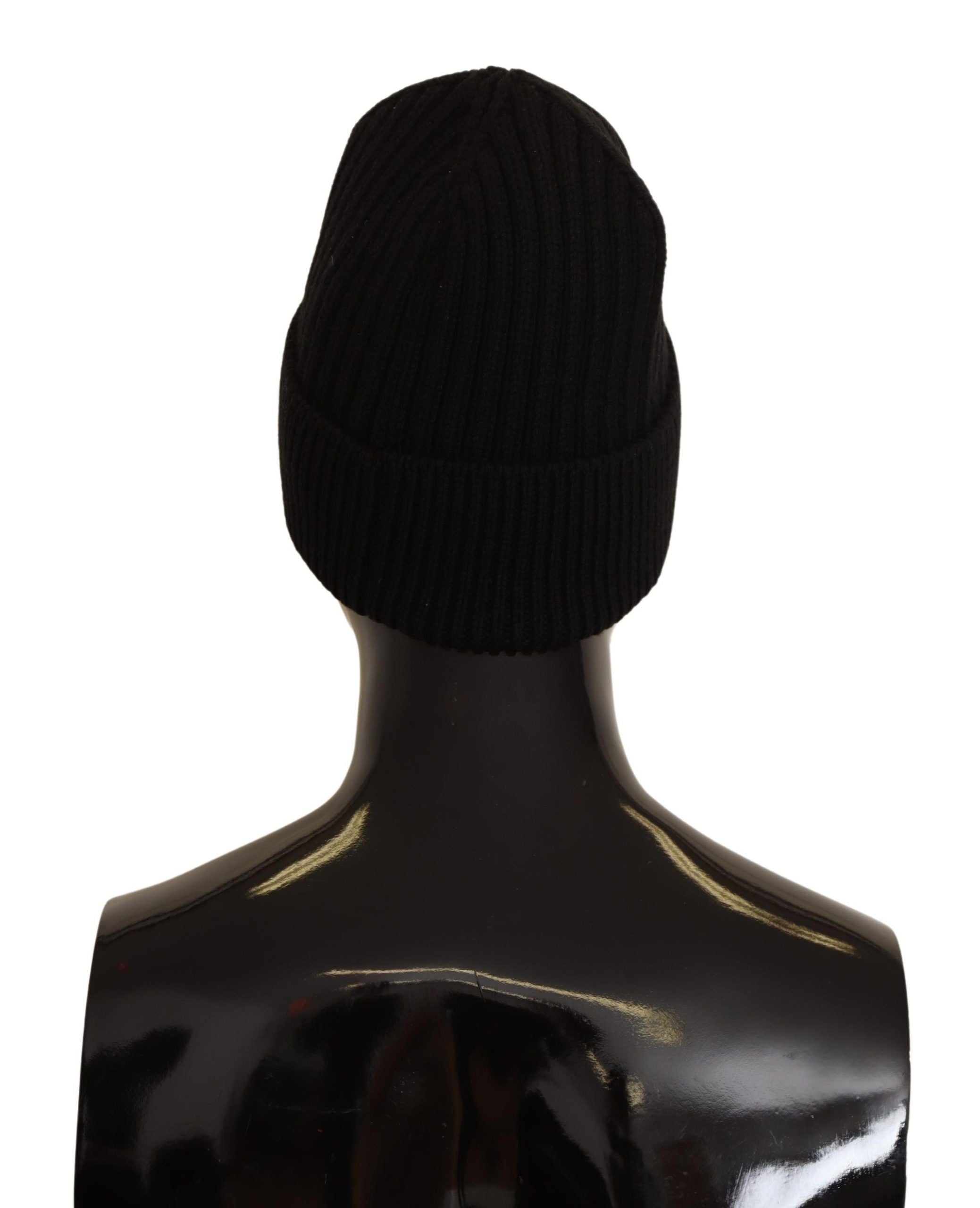 Black wool knit women's winter hat by Dolce & Gabbana, featuring a cozy, stylish knit design for cold weather.