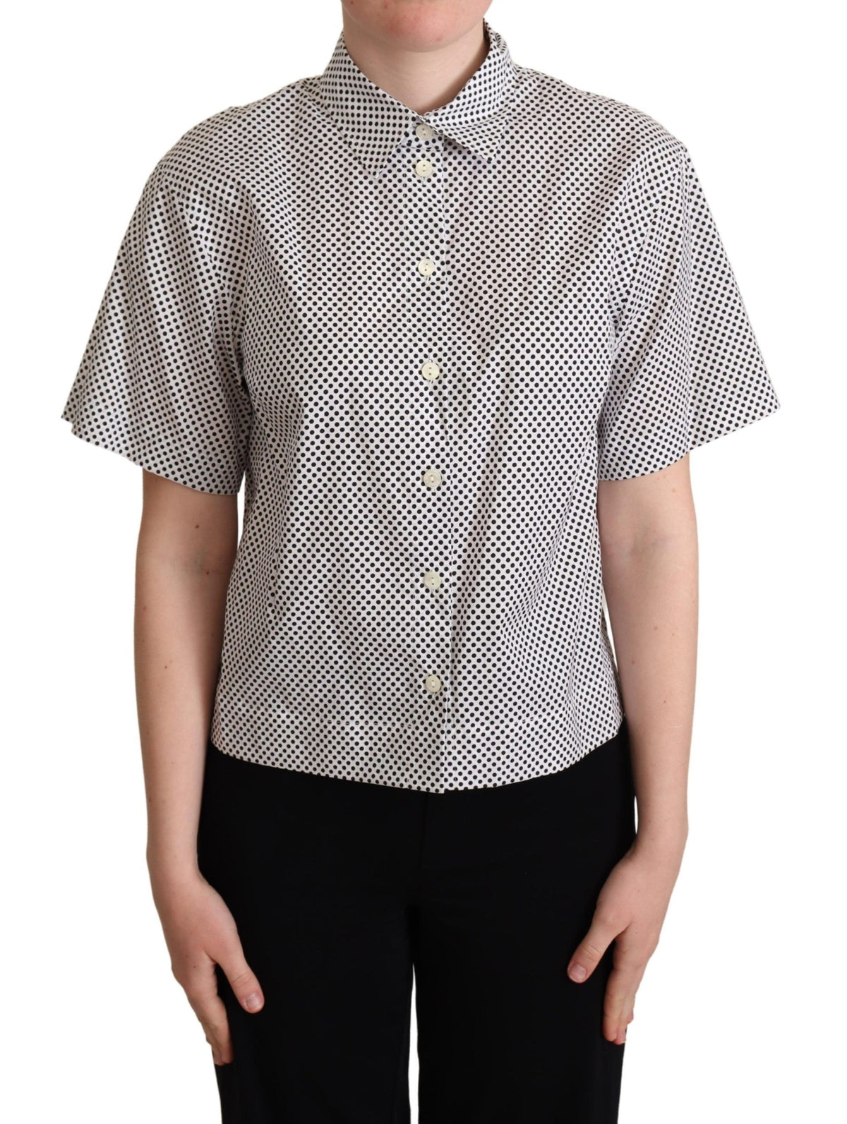 Black polka dot collared shirt by Dolce & Gabbana, featuring a white background and classic button-up design.