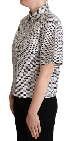 Black polka dot collared shirt by Dolce & Gabbana, with a white background and classic button-up design.