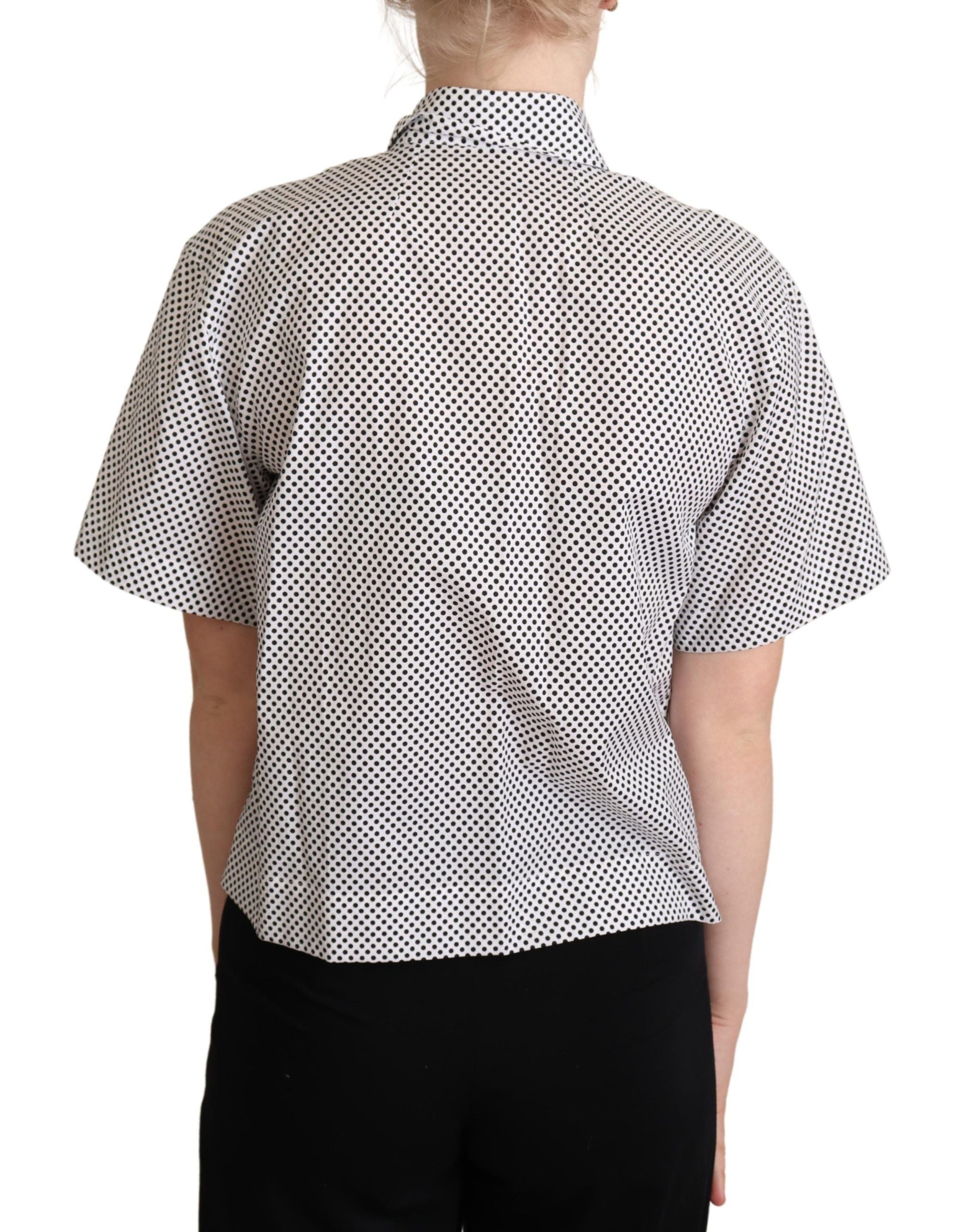 Black polka dot collared shirt with white background by Dolce & Gabbana, featuring a classic button-up design and contrasting collar.