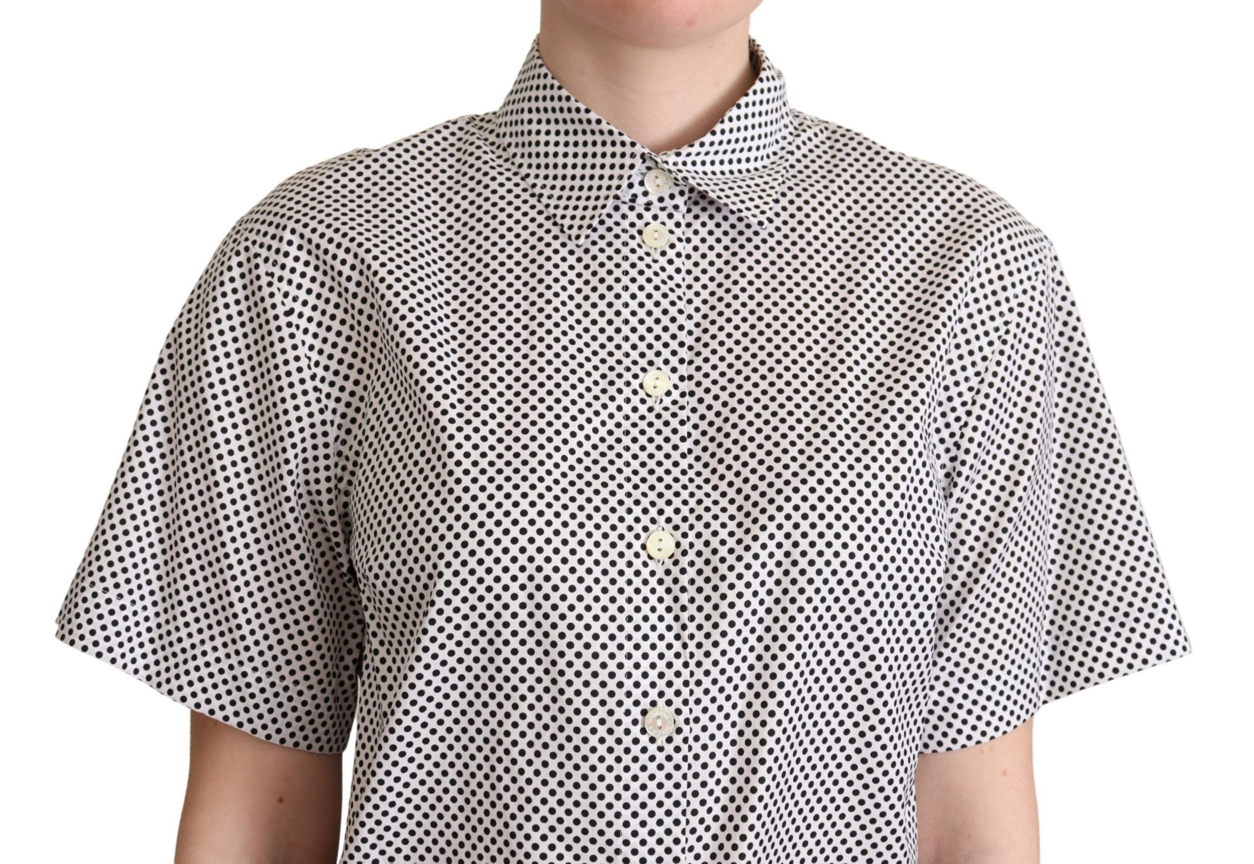 Black polka dot collared shirt by Dolce & Gabbana, featuring a white background and classic button-up design.