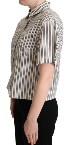 White and black striped Dolce & Gabbana blouse top with long sleeves and a classic fit, displayed on a hanger.