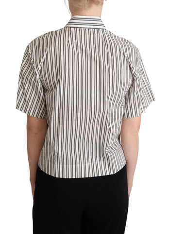 White and black striped Dolce & Gabbana blouse top with long sleeves and classic collar, shown on a hanger.