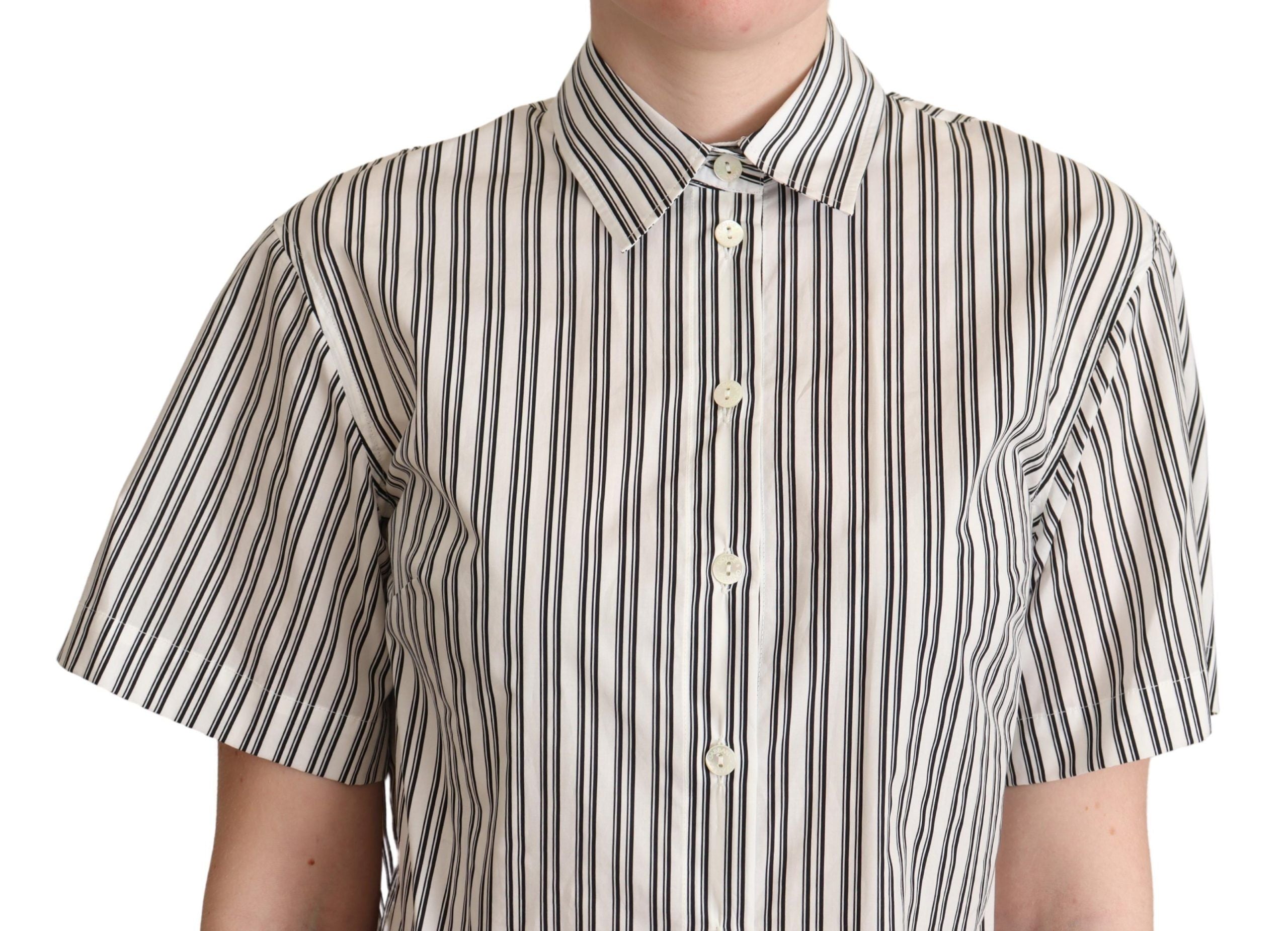 White and black striped Dolce & Gabbana blouse top with long sleeves and a classic collar, shown on a hanger.