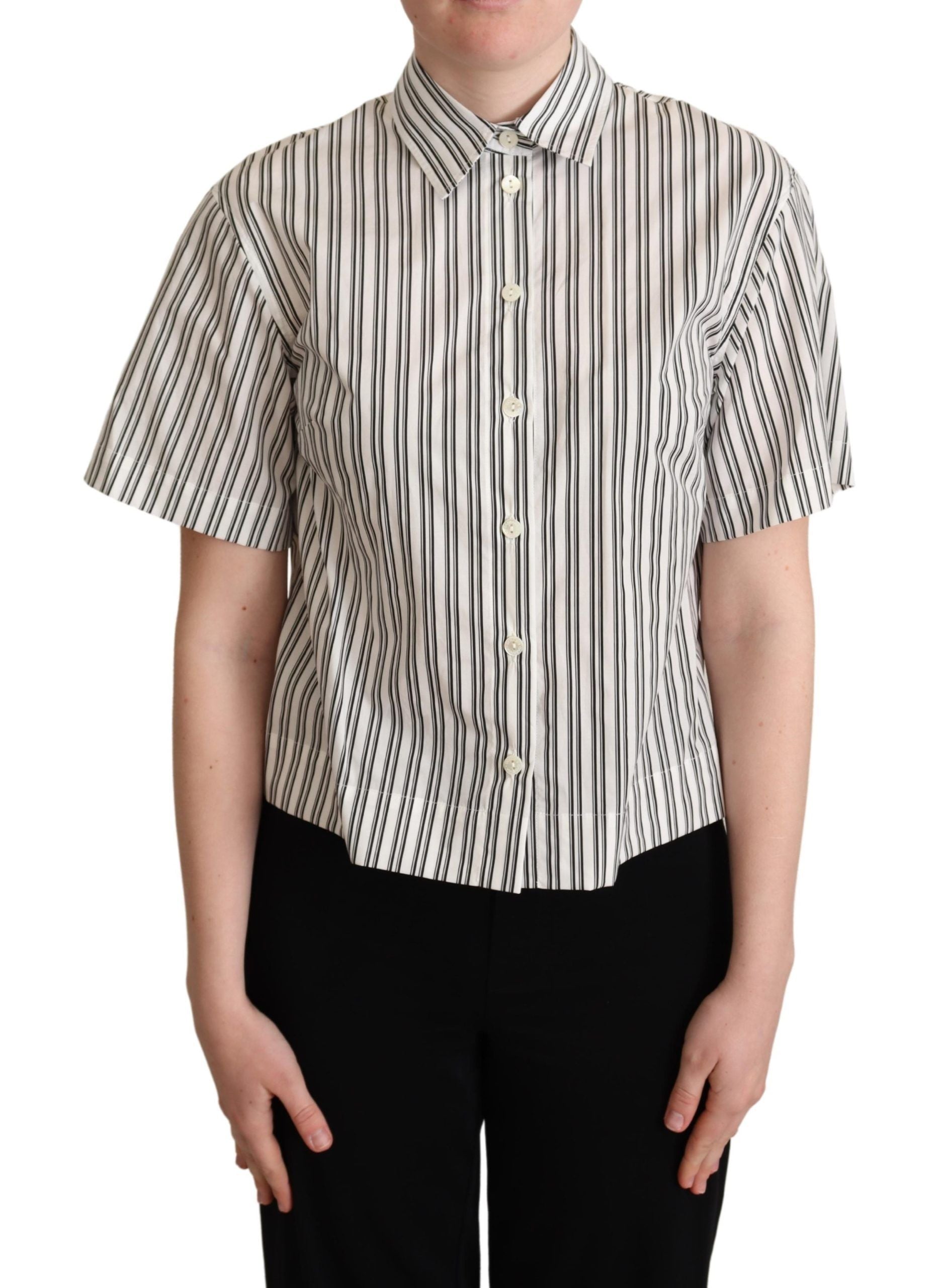 White and black striped Dolce & Gabbana blouse top with long sleeves and a classic collar, displayed on a hanger.