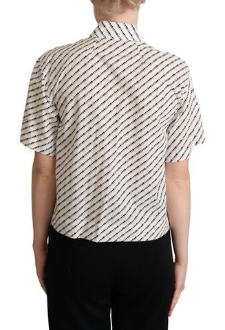 White dotted collared blouse shirt by Dolce & Gabbana, featuring a classic design with button-up front and long sleeves.