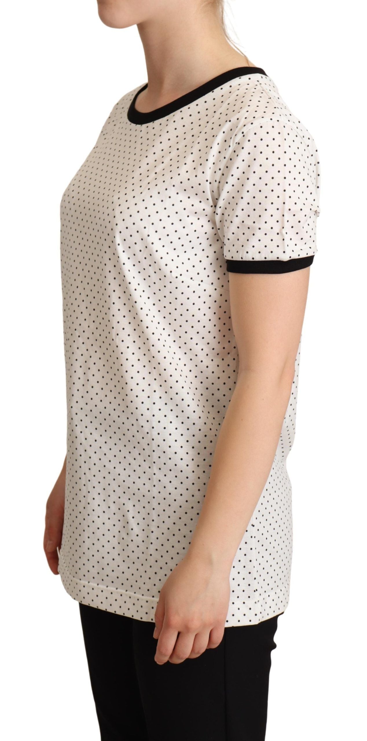 White cotton crewneck T-shirt with dotted pattern by Dolce & Gabbana, close-up showing fabric texture and design details.