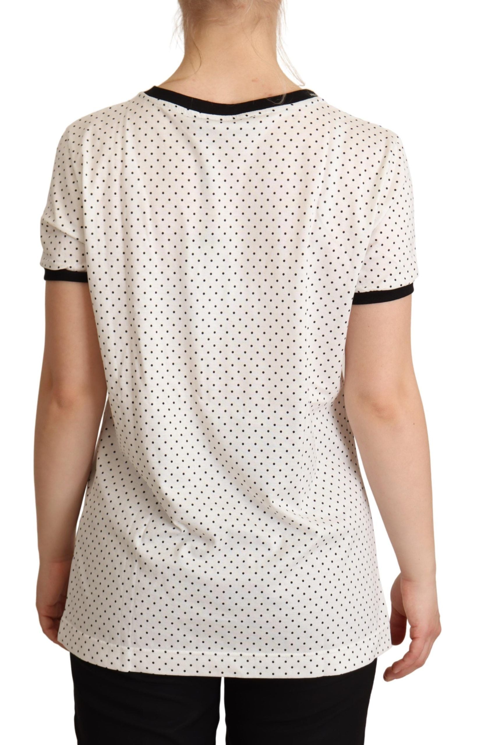 White cotton crewneck T-shirt with dotted pattern by Dolce & Gabbana, shown laid flat with visible shoulder and neckline details.