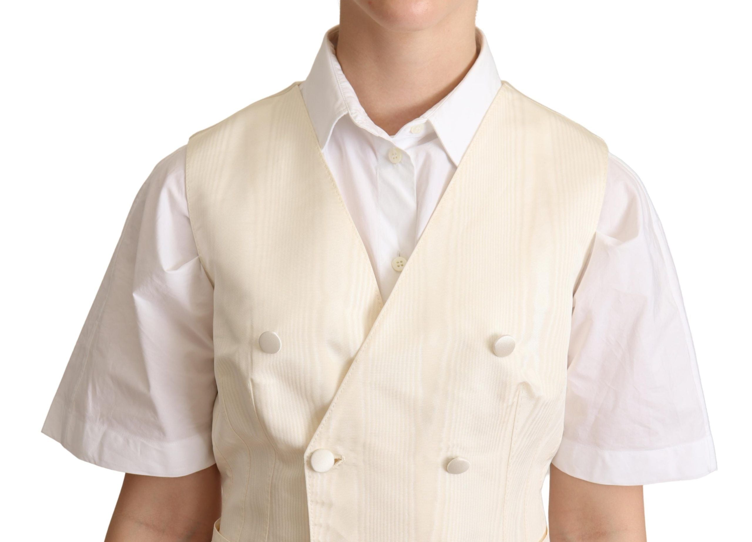 Beige silk sleeveless waistcoat vest by Dolce & Gabbana, showing smooth fabric and tailored fit on a mannequin.