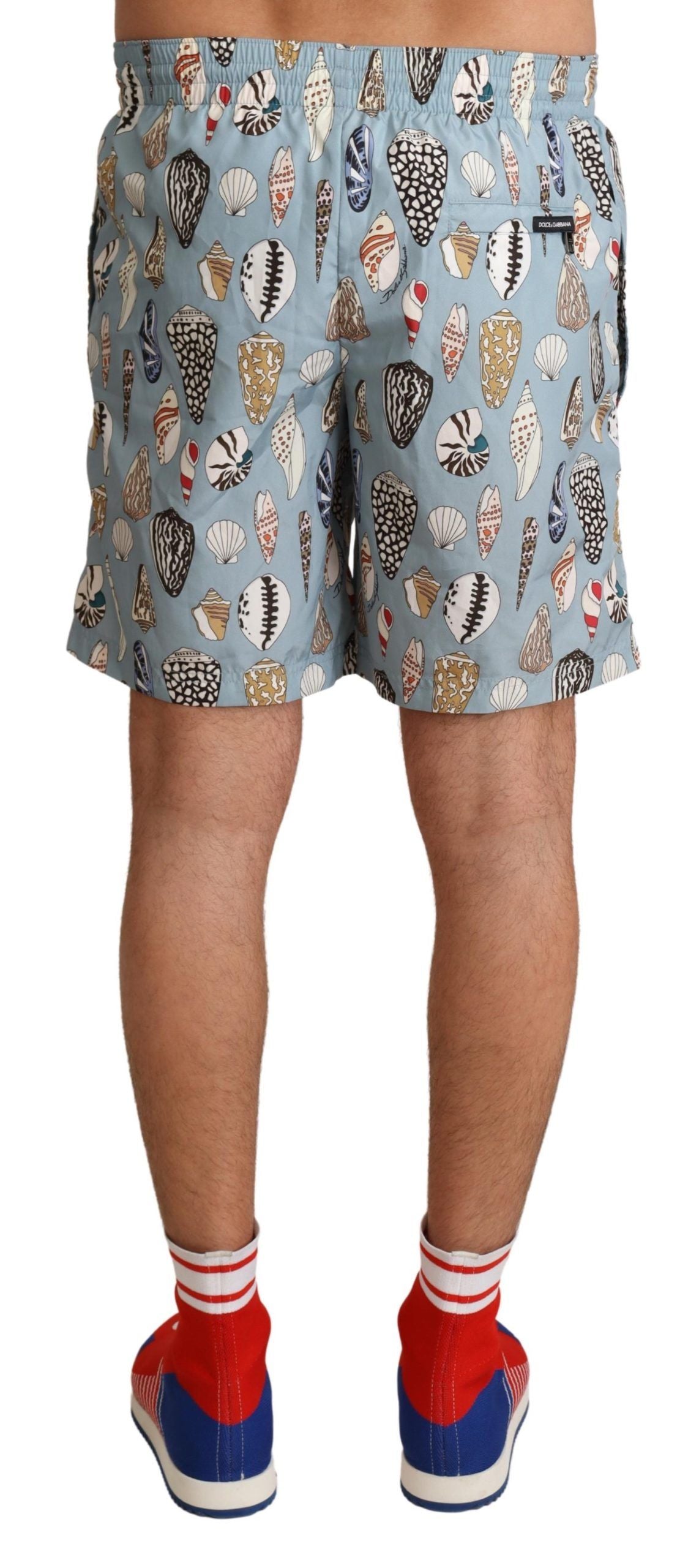 Blue seashell print Dolce & Gabbana beachwear swimwear shorts with lightweight fabric and elastic waistband.