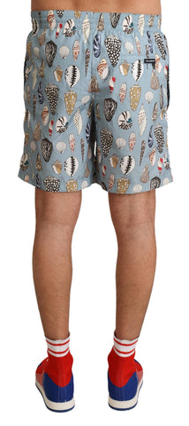 Blue seashell print Dolce & Gabbana beachwear swimwear shorts with lightweight fabric and elastic waistband.