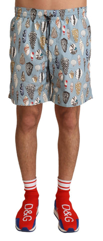 Blue seashell print Dolce & Gabbana swimwear shorts with a relaxed fit, designed for beachwear and swim activities.