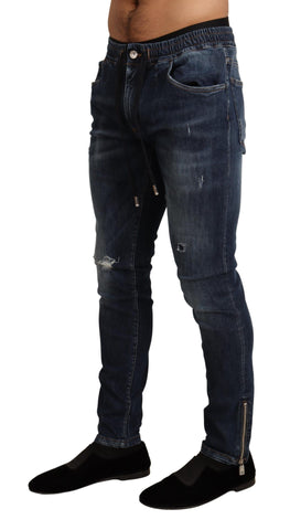 Blue cotton stretch tattered denim jeans by Dolce & Gabbana, showcasing distressed detailing and classic fit.