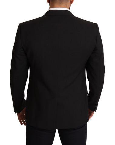 Black striped Martini blazer by Dolce & Gabbana featuring tailored fit and classic lapel collar on a stylish model.