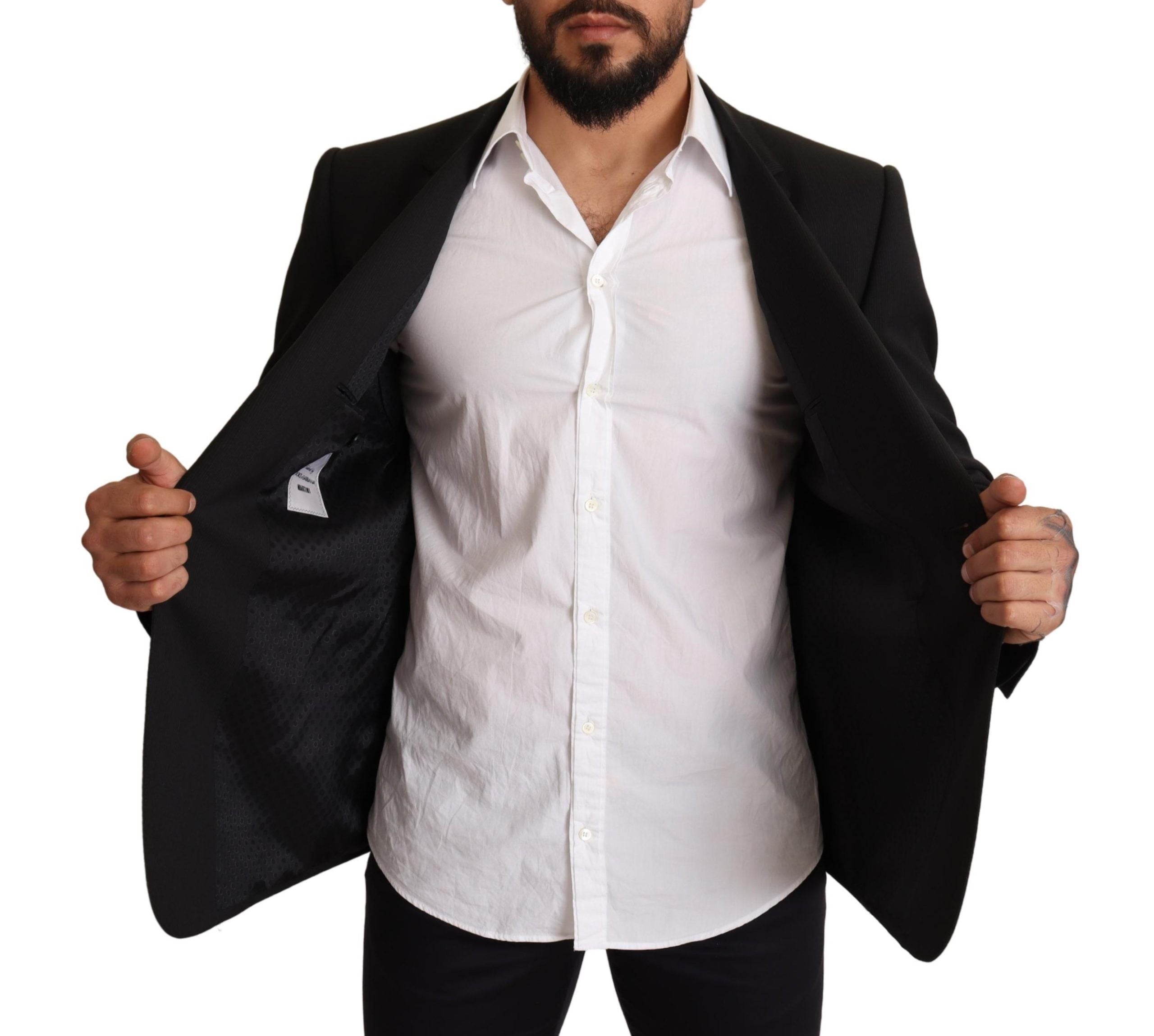 Black striped Martini blazer by Dolce & Gabbana featuring a tailored fit and classic lapel, shown on a model.