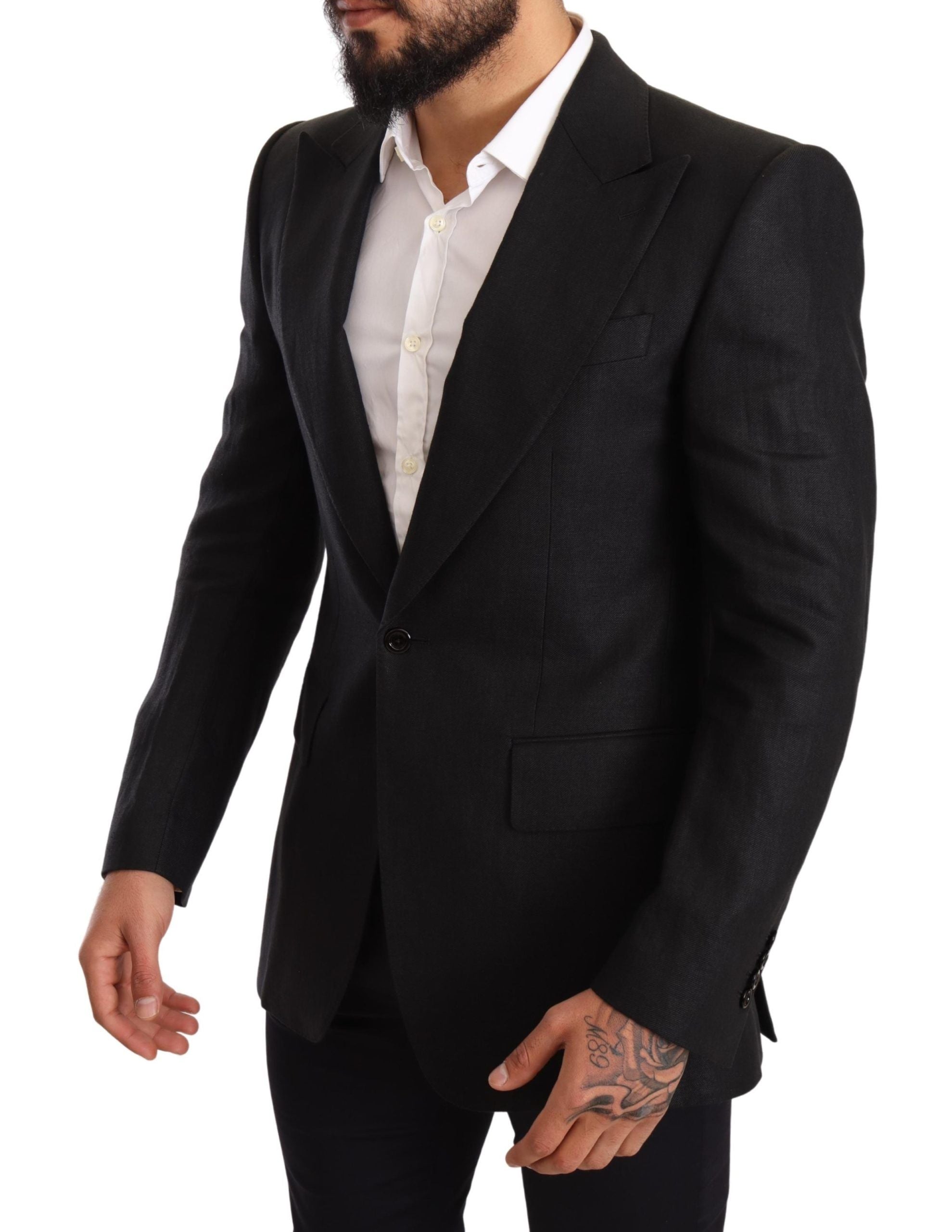 Black linen slim fit coat blazer by Dolce & Gabbana, tailored with a sharp collar and sleek design, shown on a mannequin.