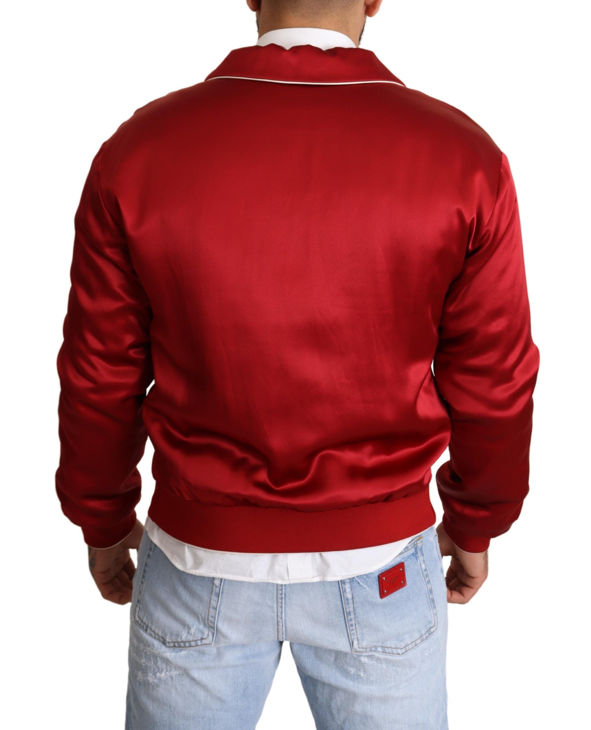 Red silk Dolce & Gabbana bomber jacket with button closure and DG logo embroidery, stylish and luxurious outerwear.