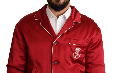 Red silk bomber jacket with DG logo buttons by Dolce & Gabbana, featuring a stylish, shiny finish and ribbed cuffs.