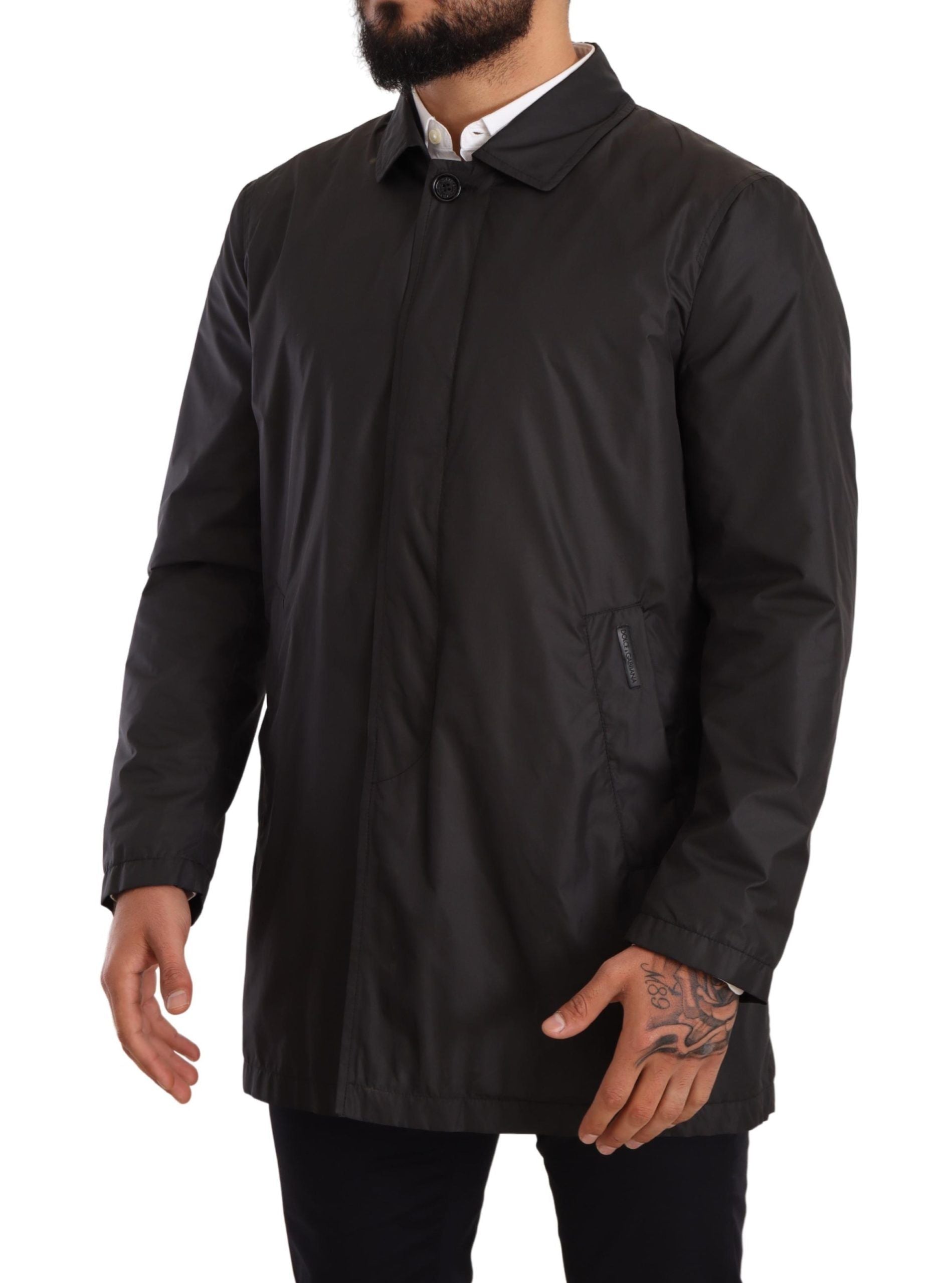 Black polyester men's trench coat jacket by Dolce & Gabbana, featuring a classic fit and stylish design.
