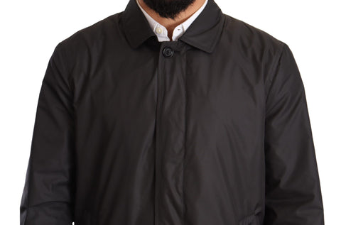 Black polyester men's trench coat jacket by Dolce & Gabbana, featuring classic design and tailored fit.