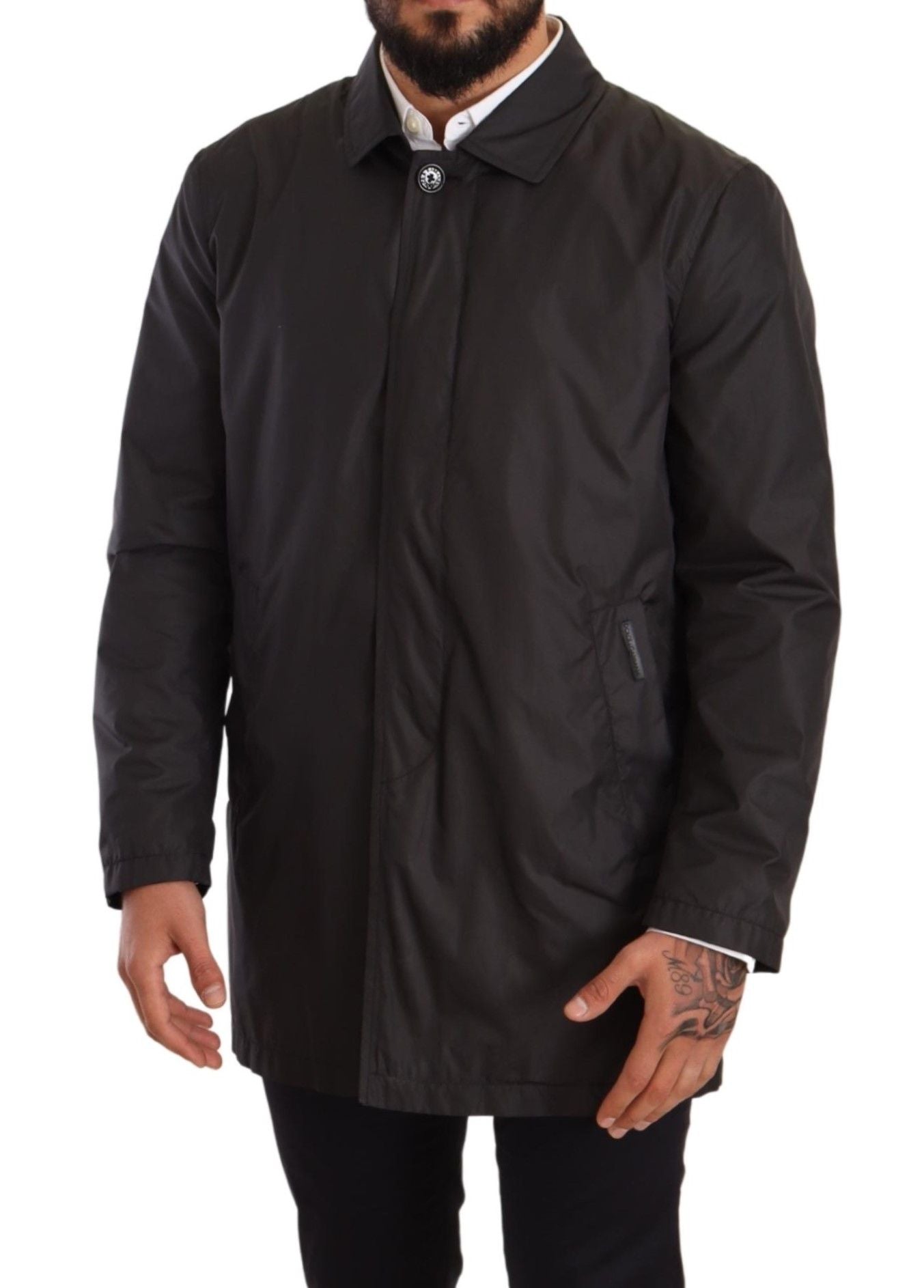 Black polyester men's trench coat jacket by Dolce & Gabbana displayed on a hanger.