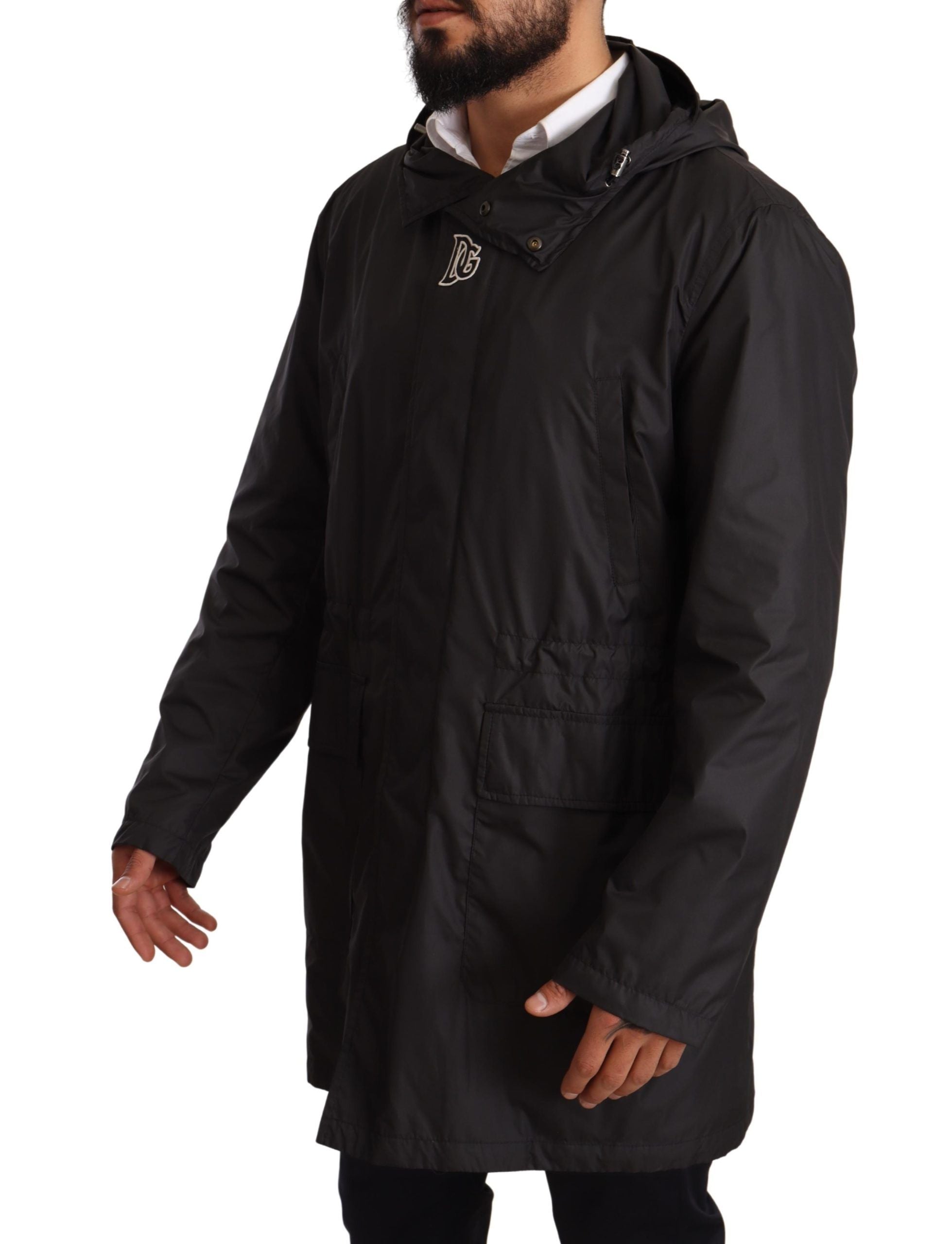 Black hooded men's trench coat jacket by Dolce & Gabbana, featuring a sleek design and classic trench style with a hood.