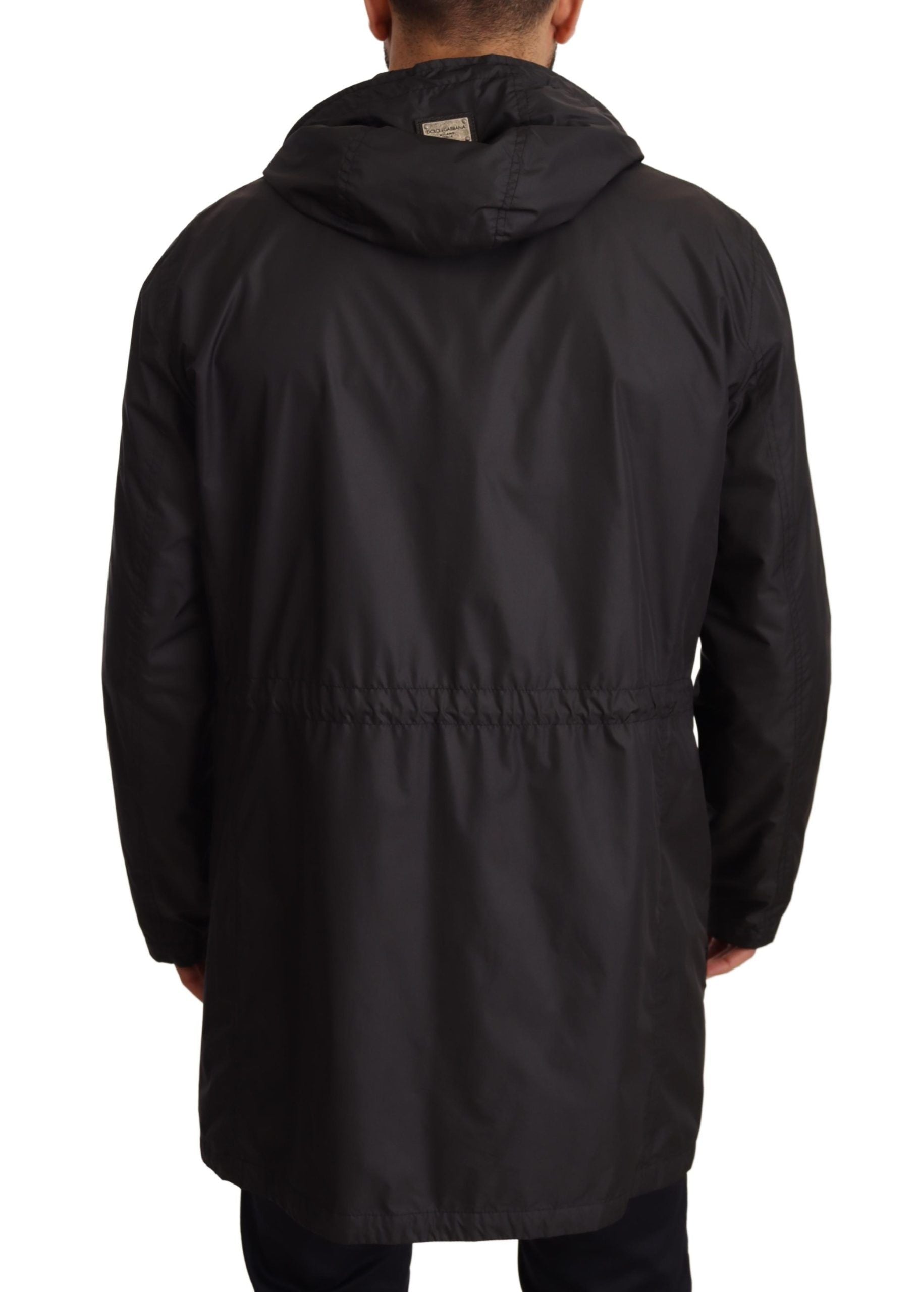 Black hooded men's trench coat jacket by Dolce & Gabbana, shown with a sleek, tailored design and stylish hood detail.