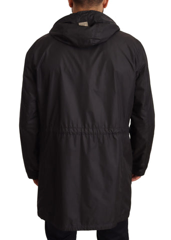 Black hooded men's trench coat jacket by Dolce & Gabbana, shown with a sleek, tailored design and stylish hood detail.