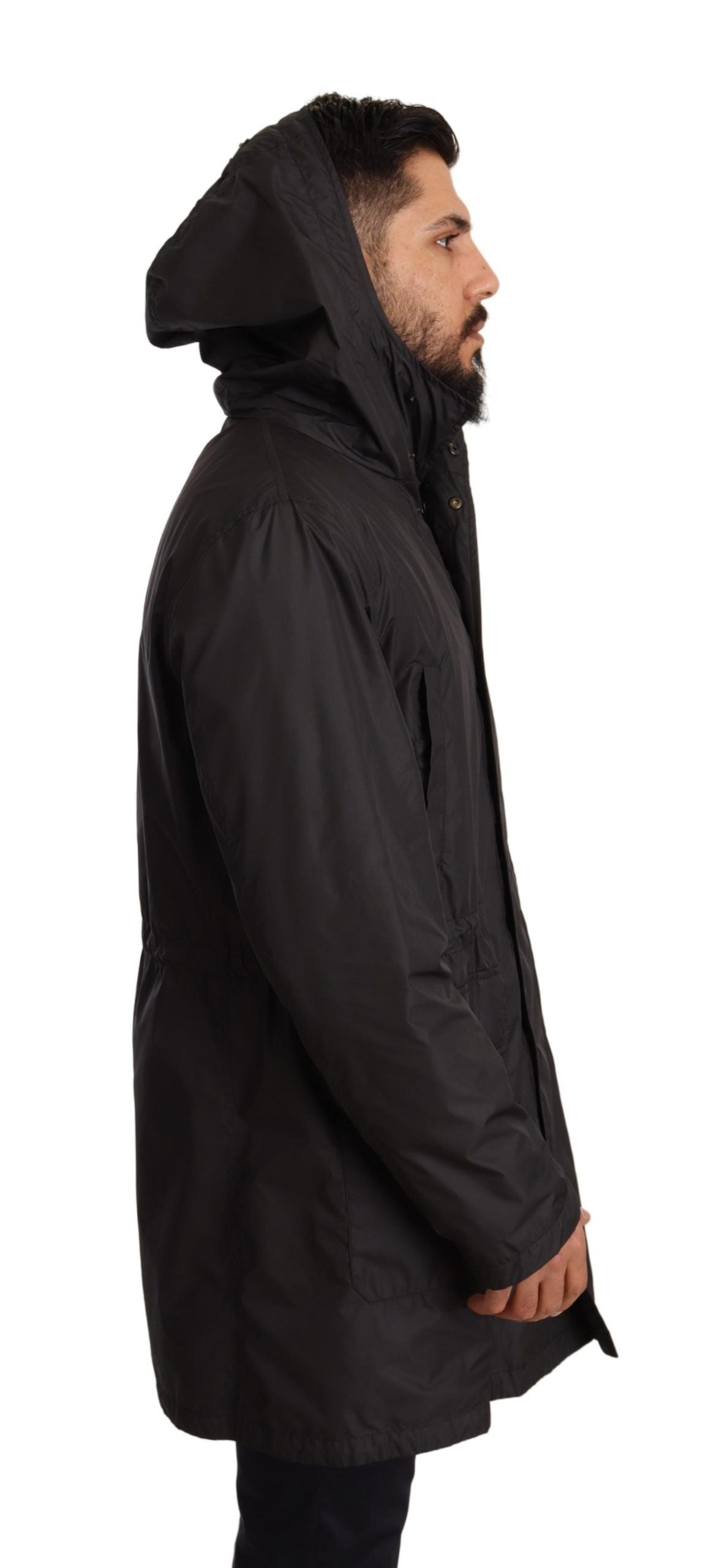 Black hooded men's trench coat jacket by Dolce & Gabbana, featuring a sleek design and classic silhouette.