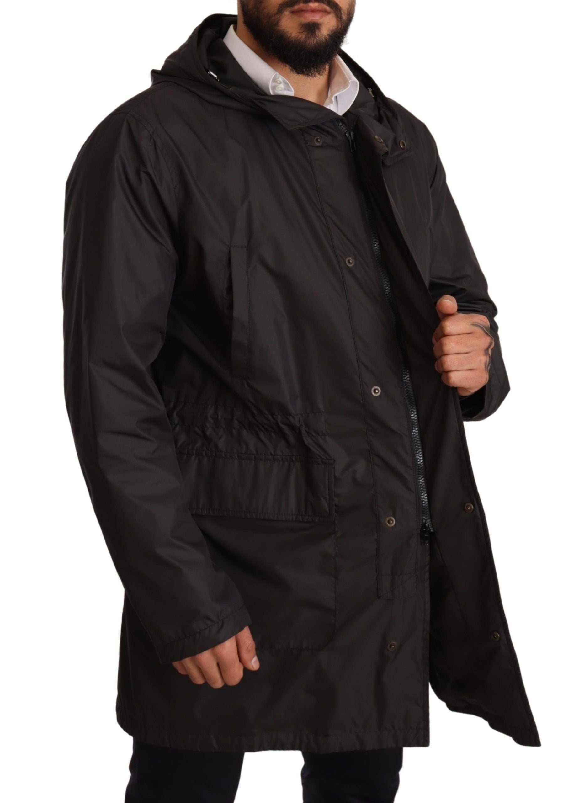 Black hooded men's trench coat jacket by Dolce & Gabbana, featuring a stylish design with a hood and classic trench details.