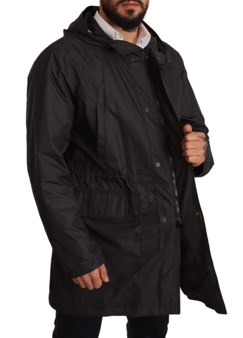Black hooded men's trench coat jacket by Dolce & Gabbana, featuring a stylish design with a hood and classic trench details.