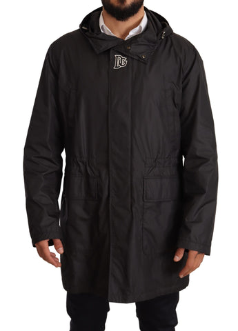 Black hooded men's trench coat jacket by Dolce & Gabbana, showing front view with hood and classic trench design.