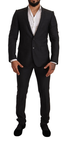Gray wool Martini slim fit suit by Dolce & Gabbana, featuring tailored jacket and matching trousers on a mannequin.