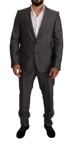 Gray metallic Martini slim fit suit set by Dolce & Gabbana, featuring tailored jacket and matching trousers.
