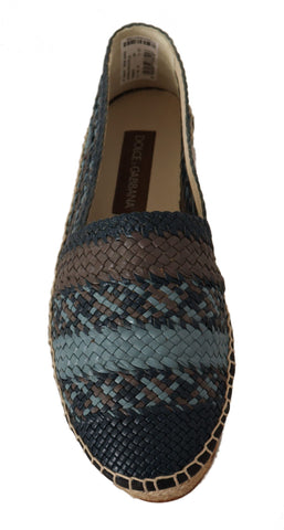 Blue and gray slip-on buffalo espadrille shoes by Dolce & Gabbana with braided jute soles and casual slip-on design.