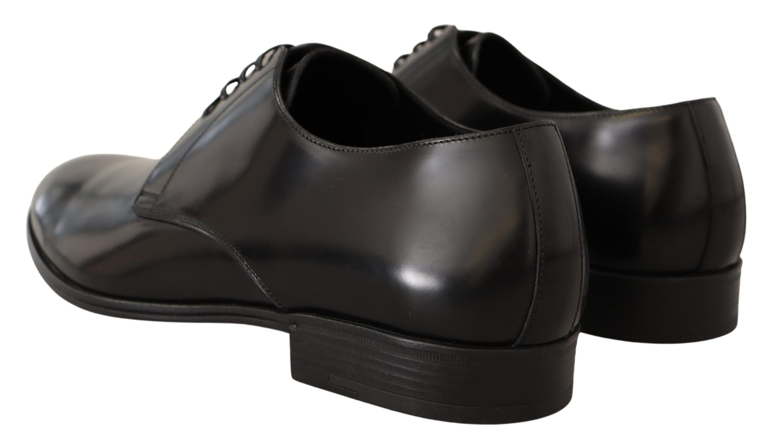 Black leather lace-up men's dress derby shoes by Dolce & Gabbana, featuring polished leather finish and classic design.
