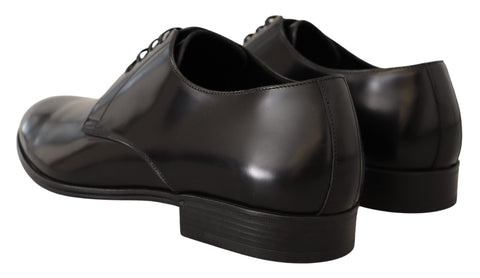 Black leather lace-up men's dress derby shoes by Dolce & Gabbana, featuring polished leather finish and classic design.
