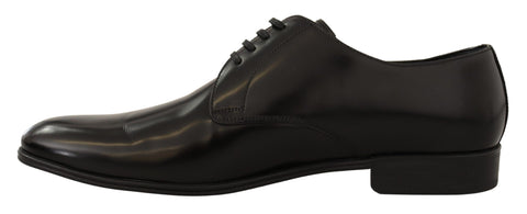 Black leather lace-up men's dress derby shoes by Dolce & Gabbana, featuring classic design and polished finish.