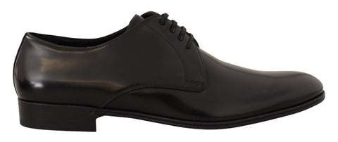 Black leather lace-up men's dress derby shoes by Dolce & Gabbana, featuring sleek design and polished finish.