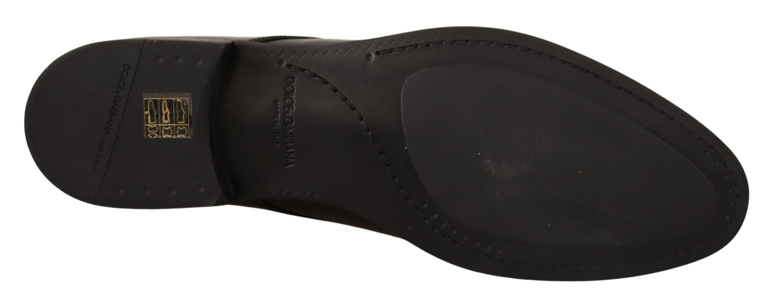 Black leather lace-up men's dress derby shoes by Dolce & Gabbana, featuring sleek design and polished finish.