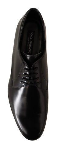 Black leather lace-up men's dress derby shoes by Dolce & Gabbana, featuring polished finish and classic design.