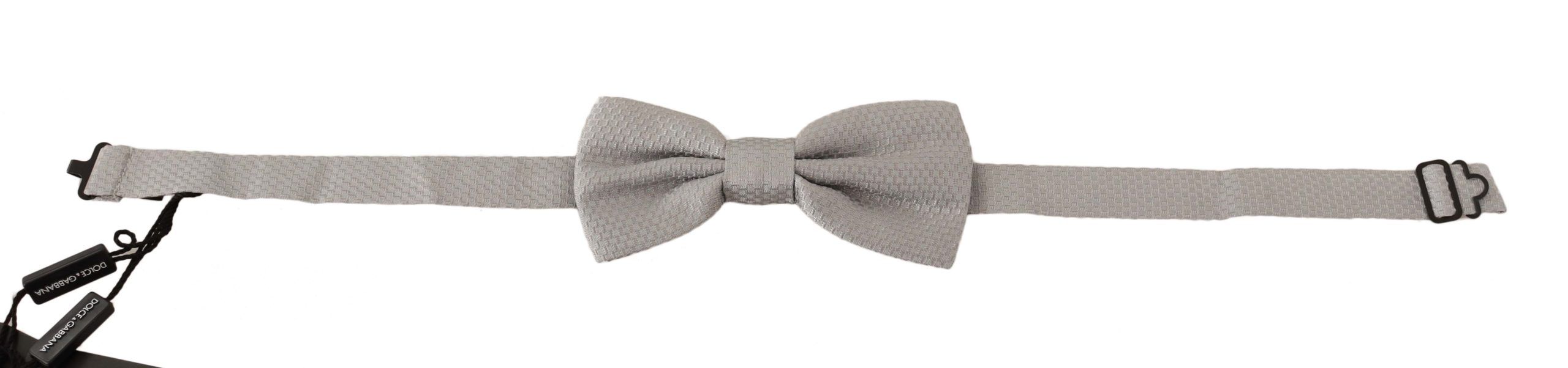 Silver gray silk adjustable bow tie with papillon style from Dolce & Gabbana, showcasing a sleek, elegant design for formal wear.