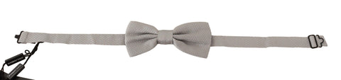 Silver gray silk adjustable bow tie with papillon style from Dolce & Gabbana, showcasing a sleek, elegant design for formal wear.