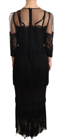 Black sheer floral lace crystal maxi dress by Dolce & Gabbana displayed on a model, showcasing intricate lace details and elegant design.