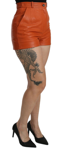 Orange leather high waist hot pants shorts by Dolce & Gabbana, featuring a slim fit and stylish design.