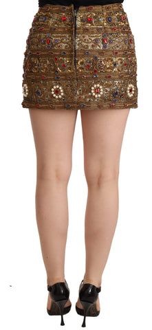 Gold crystal jacquard high waist skirt by Dolce & Gabbana, showcasing intricate pattern and luxurious fabric detail.