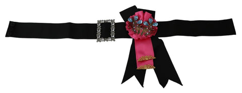 Black pink flower brooch with crystals attached to a cotton belt, designed by Dolce & Gabbana, showcasing elegant floral jewelry.