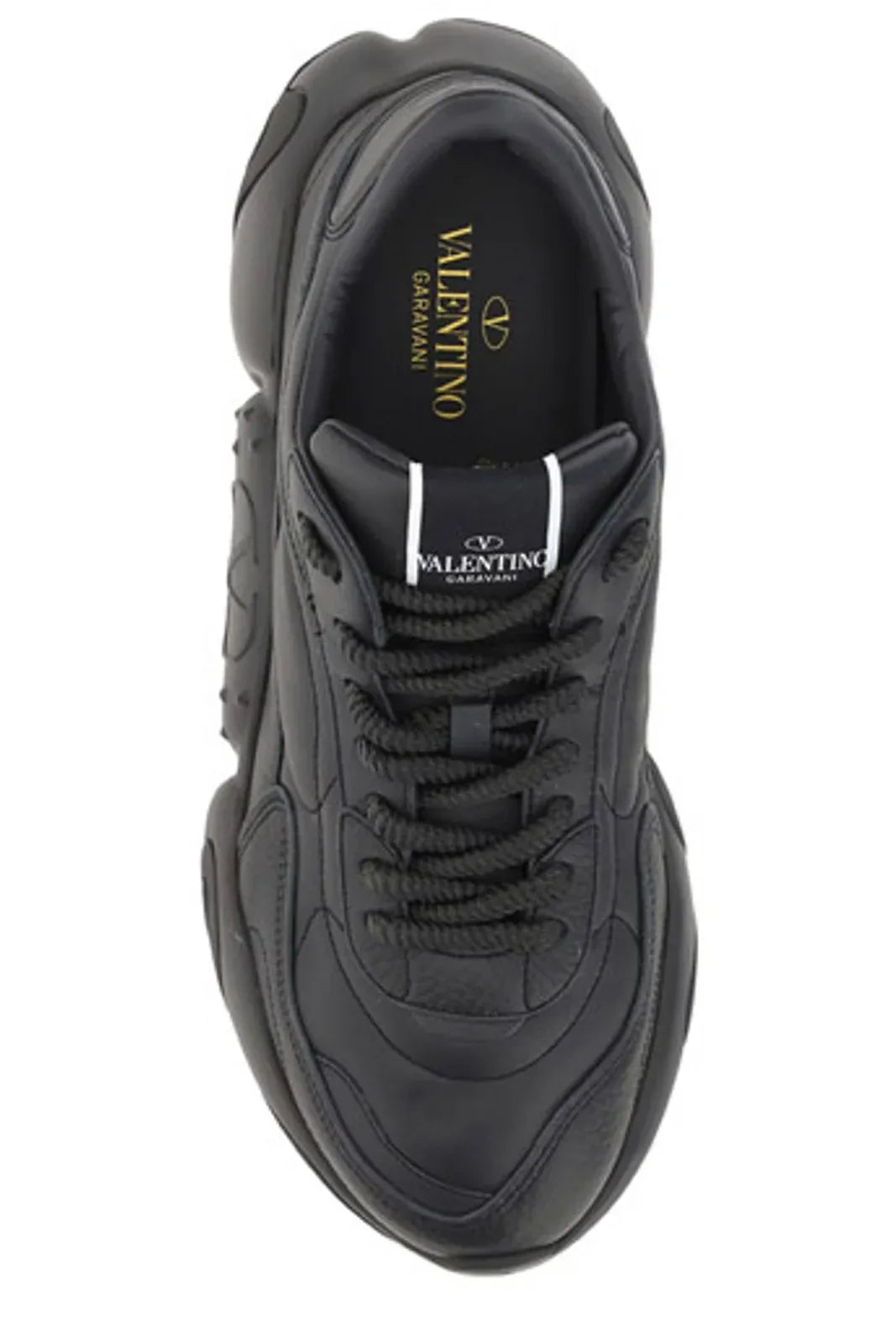 Black calf leather Valentino Garavani sneakers with sleek design and white rubber soles, displayed on a plain background.